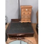 An early 19th century clerk's desk in oak and mahogany; a modern pine small chest of 4 drawers