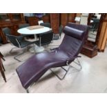 A 1960's / 70's chrome framed 'Executive Unwinder Relaxator' in aubergine leather effect upholstery,