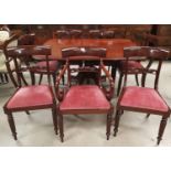 A Regency set of 7 (6 + 1) mahogany dining chairs, with bar backs and turned centre rails, on turned