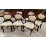 A Victorian set of 6 mahogany dining chairs with balloon backs, on cabriole legs, the seats and back