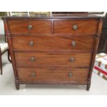 An early 19th century Regency period mahogany chest of 3 long and 2 short drawers, turned side