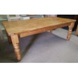 A large rectangular pine farmhouse kitchen table on heavy turned leg, length 84". width 48"