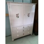A Victorian pine pink painted press cupboard with double door cupboard, 2 long and 2 short drawers