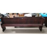 A pitch pine pew, length 100"