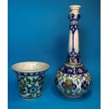 A Persian Iznik bottle shaped vase decorated with flowers in blues and greens, height 12.52 (neck