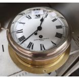 A ship's "porthole" clock in brass, by Smiths, diameter 8"