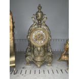 A brass cased late 19th/ early 20th century mantel clock stamed G.R to movement (glass damaged or