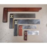 Two 19th century ebony and brass mounted steel set squares, 14" and 3 others