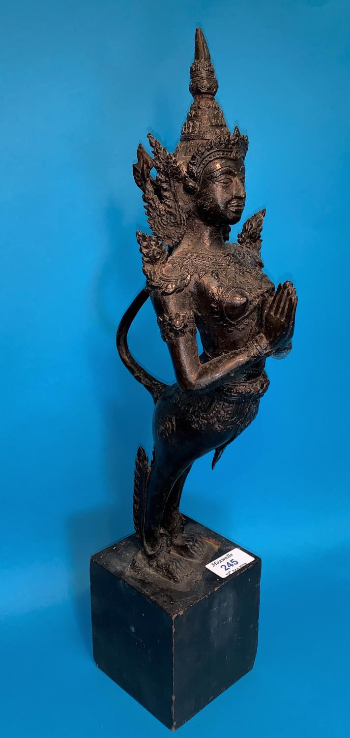 A Thai bronze figure of a goddess with hands folded in prayer and long tail on wooden plinth, height - Image 4 of 4