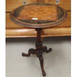 A 19th century Victorian games table with inlaid walnut circular top, on reeded pedestal and
