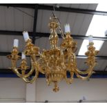 A brass period style 8 branch chandelier