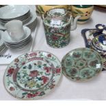 A Chinese famille vert plate with painted flower decoration and a stamp on the back, diameter