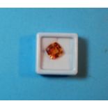 A cushion cut natural orange sapphire, 9.05 carats, with GGL certificate (enhanced)(10.52 x 10.44