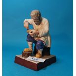 A Russian Gardner porelain figure of "Lapti Plaiter" (Bast shoemaker, by the Gardner Facory,