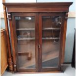 A Victorian mahogany bookcase top enclosed by 2 glazed doors