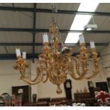 A brass period style 8 branch chandelier