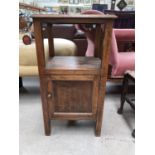 An oak bedside cabinet