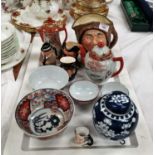 A Royal Doulton large toby jug "Sairey Gamp"; a Winston Churchill jug; an Imari bowl; a satsuma