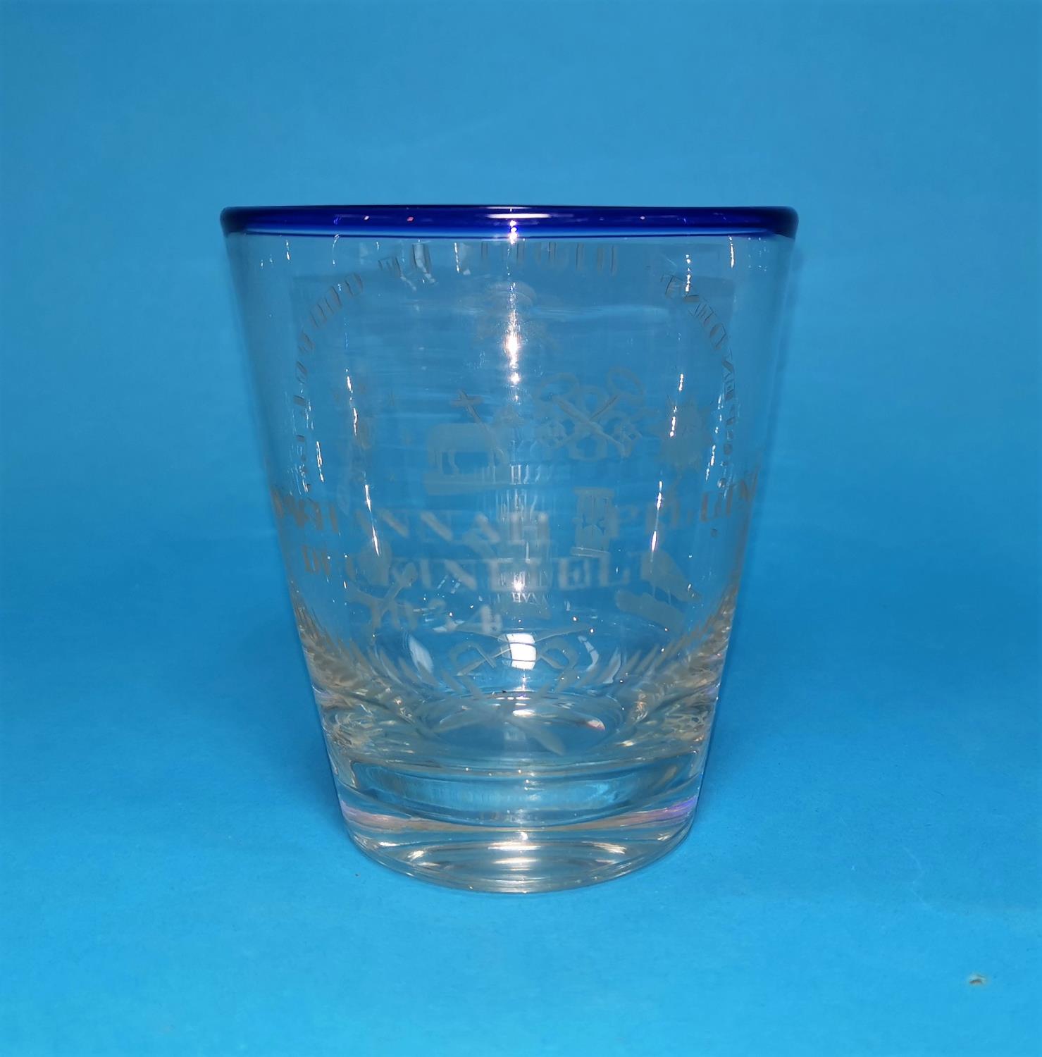 An engraved ceremonial glass for the Order of Oddfellows, with blue rim, engraved: "John and