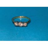 A 1930's 18 carat gold dress ring set 3 diamonds