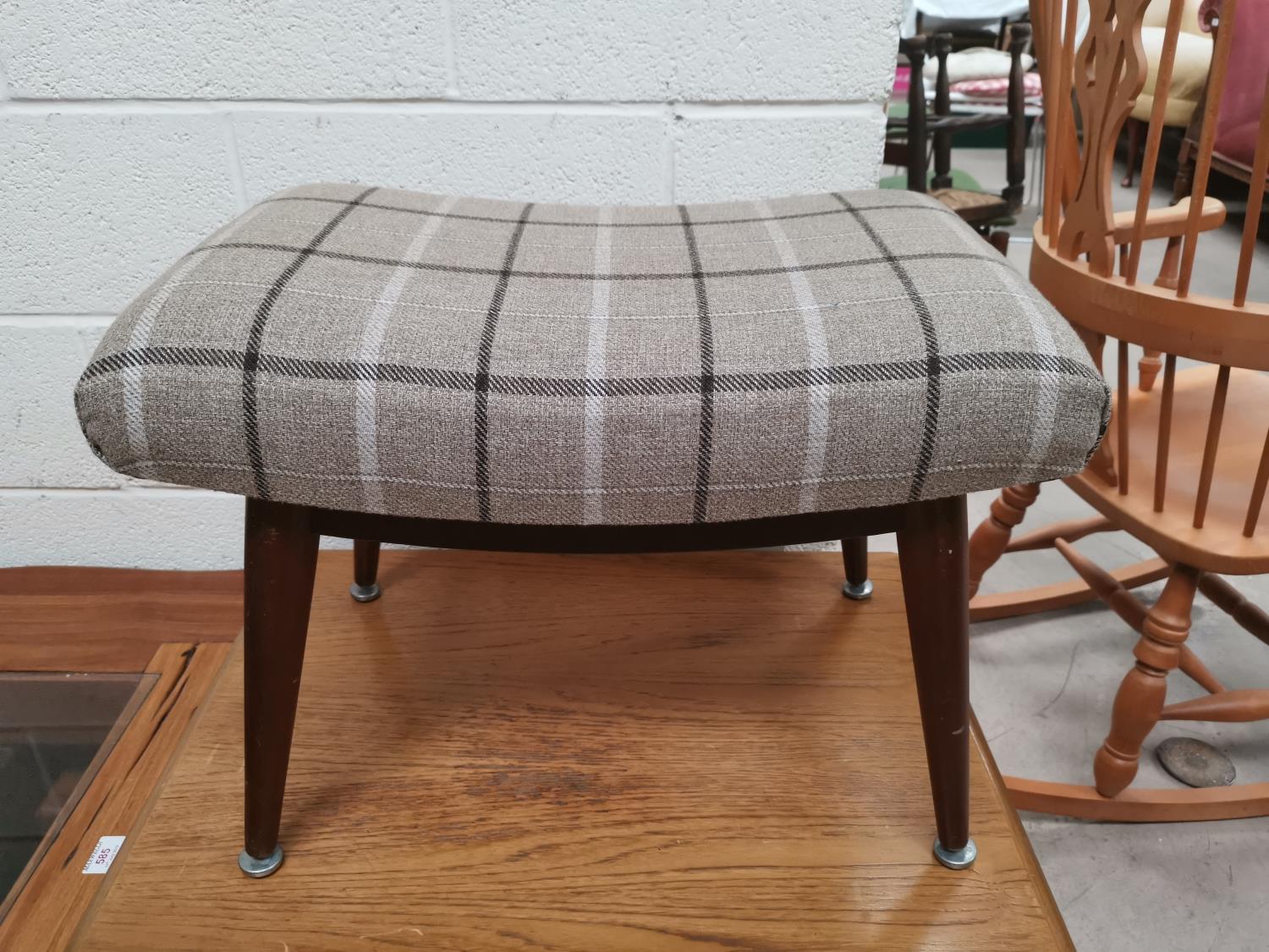 A teak retro stool upholstered in tartan fabric