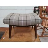 A teak retro stool upholstered in tartan fabric