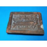 A medieval rectangular terracotta weight, decorated in relief with a courtly scene, 14.5 cm x 10.5