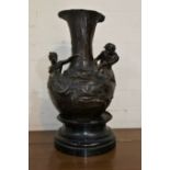 A large Art Nouveau (c.1900) patinated bronzed vase with naked male and female mermaid figures