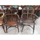 A 19th century near pair of Windsor chairs with low backs and crinoline stretcher