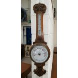 A late Victorian oak banjo barometer