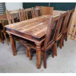 A Mediterranean style rustic dining suite comprising table and 6 matching chairs