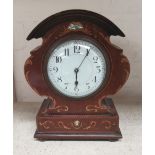 An Edwardian arch top inlaid mantel clock with white enamel dial and balance spring movement