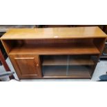 A 1970's teak bookcase 'Stateroom' by Stonehill, with shelf, cupboard and twin sliding glass doors