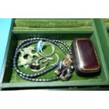 A selection of costume jewellery in leather covered box