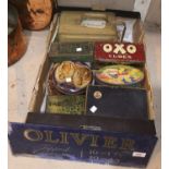 An early 20th century glass advertising sign for Olivier cigarettes; a collection of old tins; a