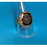 A gent's 9 carat hallmarked gold signet ring set intaglio carved black stone depicting Caesar's