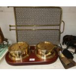A reproduction ship's brass clock and barometer; a gilt and glass table lamp; a brass oil lamp;