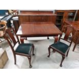 A 1920's mahogany period style dining room suite comprising draw leaf table and 6 chairs on cabriole