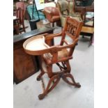 An Edwardian child's metamorphic high chair in stained beech