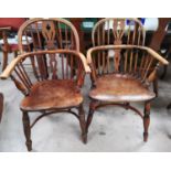 A 19th century near pair of Windsor chairs with low backs and crinoline stretcher