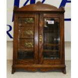 An Edwardian oak smoker's cabinet