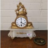 A 19th century mantel clock in gilt metal and alabaster, white enamel dial and French timepiece