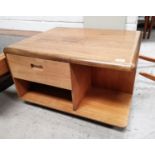 A 1970's pale oak coffer table with cupboard, drawer and shelf under, 28" x 24"