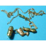 Various charms and a piece of yellow metal chain, 8.2 gm gross