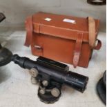 An early mid 20th century japanned theodolite by Entwistle Thorpe & Co in leather case;A drainage/