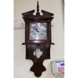 A mahogany reproduction wall clock, weight driven 30 day movement