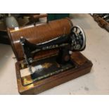 A singer oak cased sewing machine