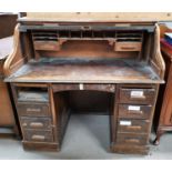 An 'S' roll top twin pedestal desk, vintage oak finish, 48"