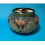 A Moorcroft Macintyre tobacco jar, tube lined and decorated with acanthus against a pitted blue
