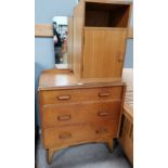 A 1970's G Plan light oak dressing table of 3 drawers; a similar bedside cupboard